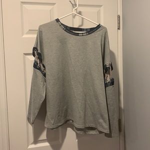 Grey long sleeve with blue checker arms and collar